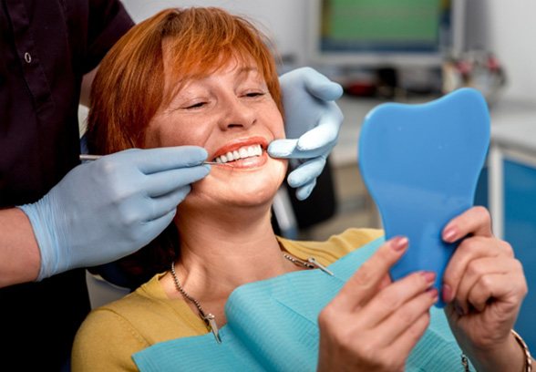 patient smiling while visiting dentist