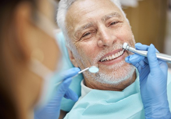 patient smiling while visiting dentist