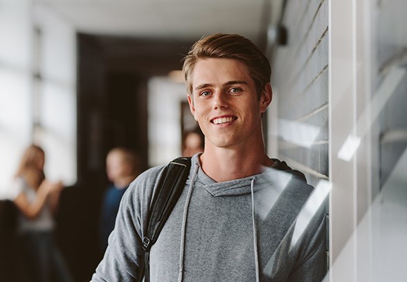 Young man with healthy smile after restorative dentistry