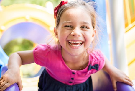 Little girl with healthy smile thanks to tooth-colored fillings