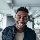 Man smiling in office after cosmetic dentistry in Loveland, OH