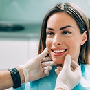 patient smiling while looking at dentist 