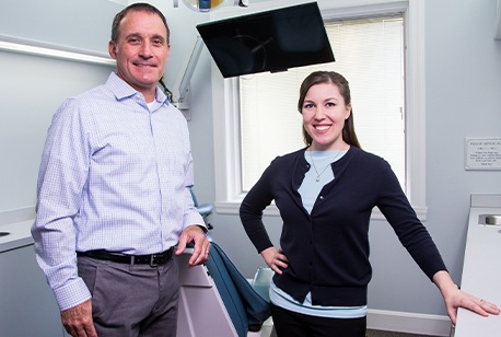 Dr. Patrice and Dr. Gerome in dental office exam room