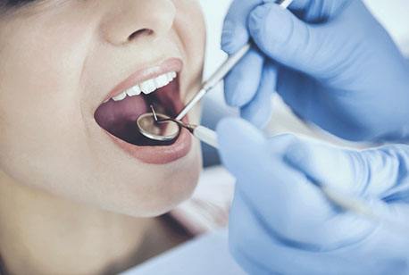 An up-close look at a dentist performing a checkup on a patient