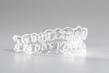An up-close look at two clear aligners designed to straighten a person’s smile