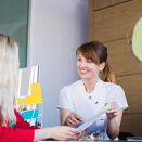 Female dental patient learning about options for paying for Smart Moves