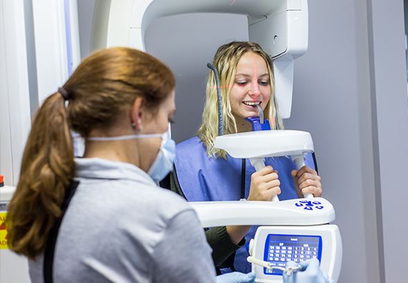 Woman receiving 3D dental x-rays