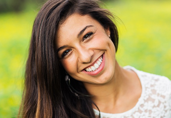 Woman sharing bright smile after teeth whitening