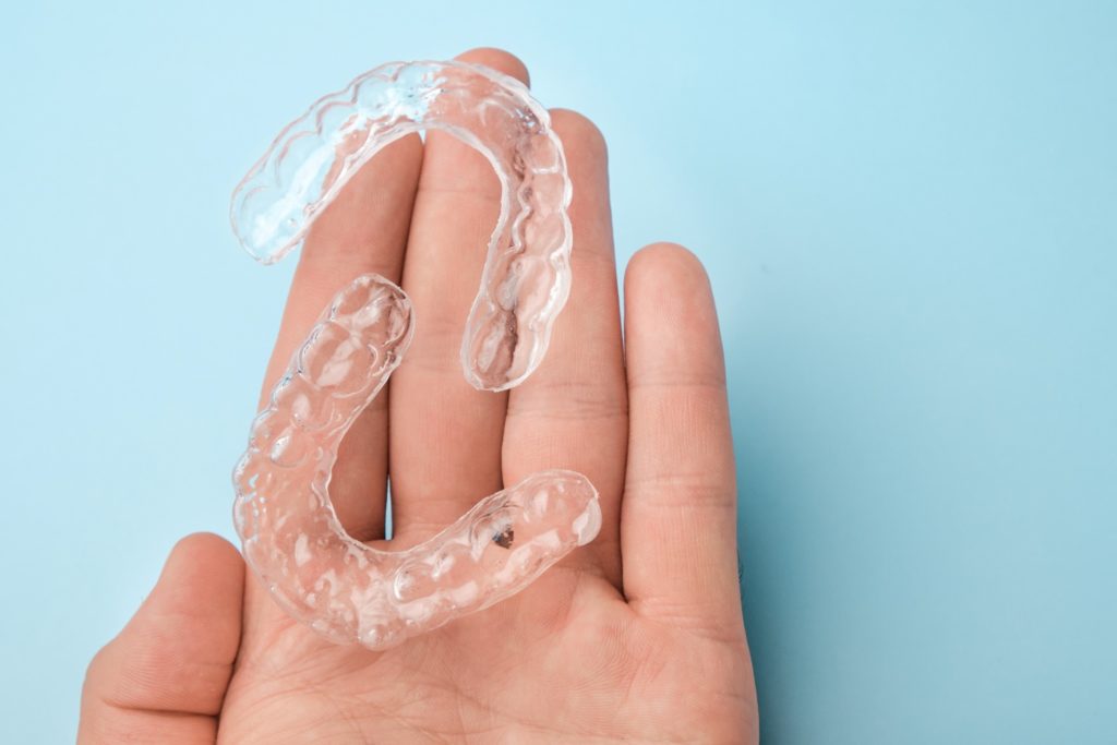 Patient holding Invisalign alternative