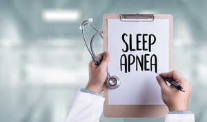Clipboard with words “sleep apnea” written on it