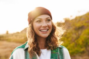 a person hiking and smiling