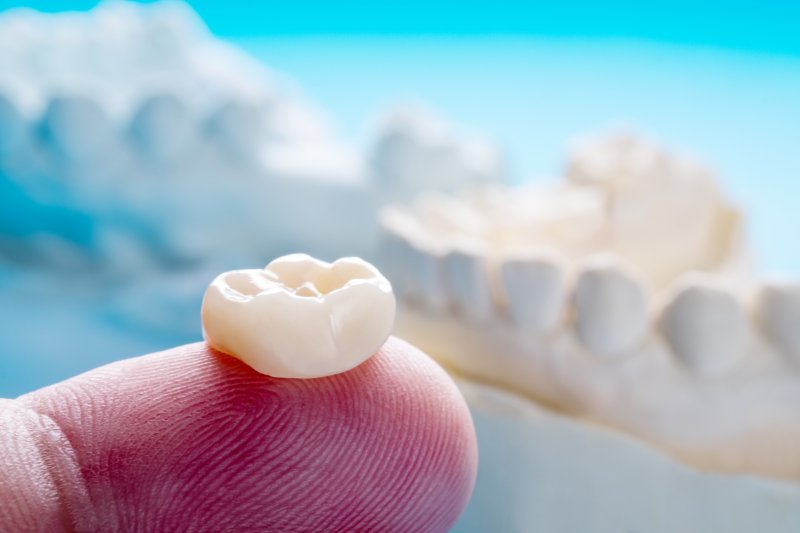 Dental crown on finger